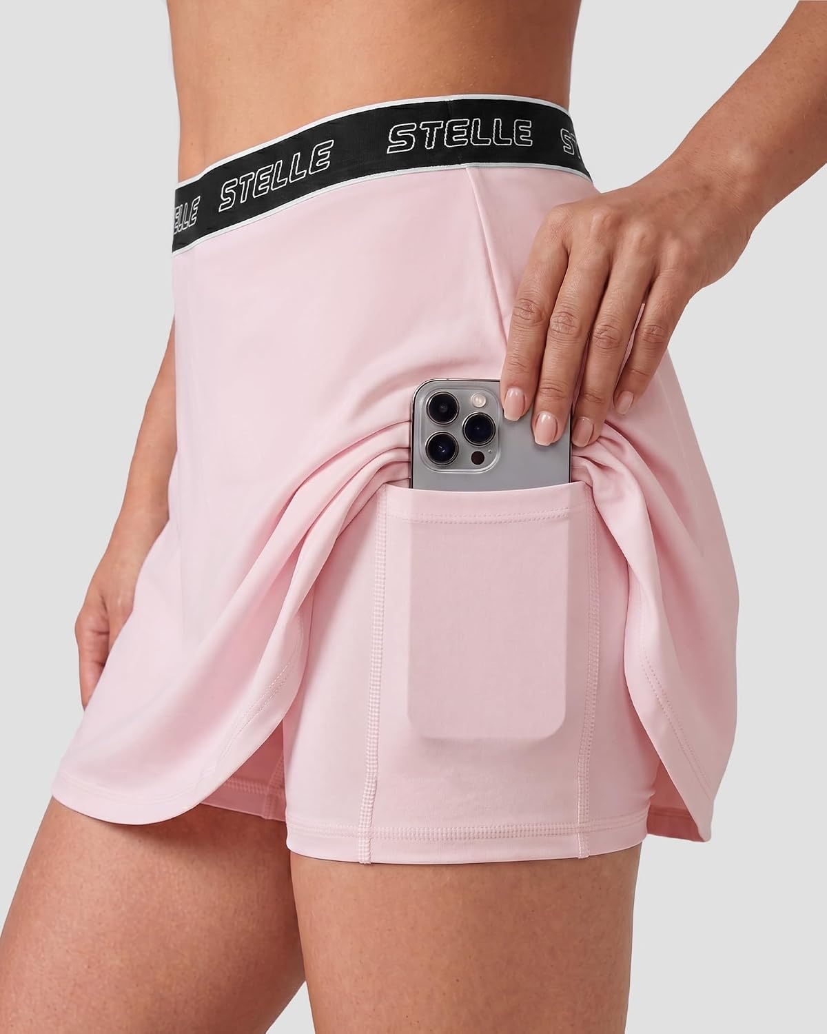 Stelle Women High Waisted Tennis Skirt with Pockets Golf Athletic Skorts | Athletic Skirt, High Waisted, Logo Waistband, A-Line Fit, Built-In Shorts, Dual Pockets, Breathable, Pickleball, Running(Ballet Pink)
